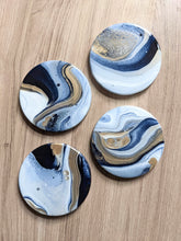 Load image into Gallery viewer, Blue, gold and white marbled coasters