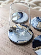 Load image into Gallery viewer, Blue, gold and white marbled coasters