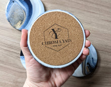 Load image into Gallery viewer, Blue, gold and white marbled coasters