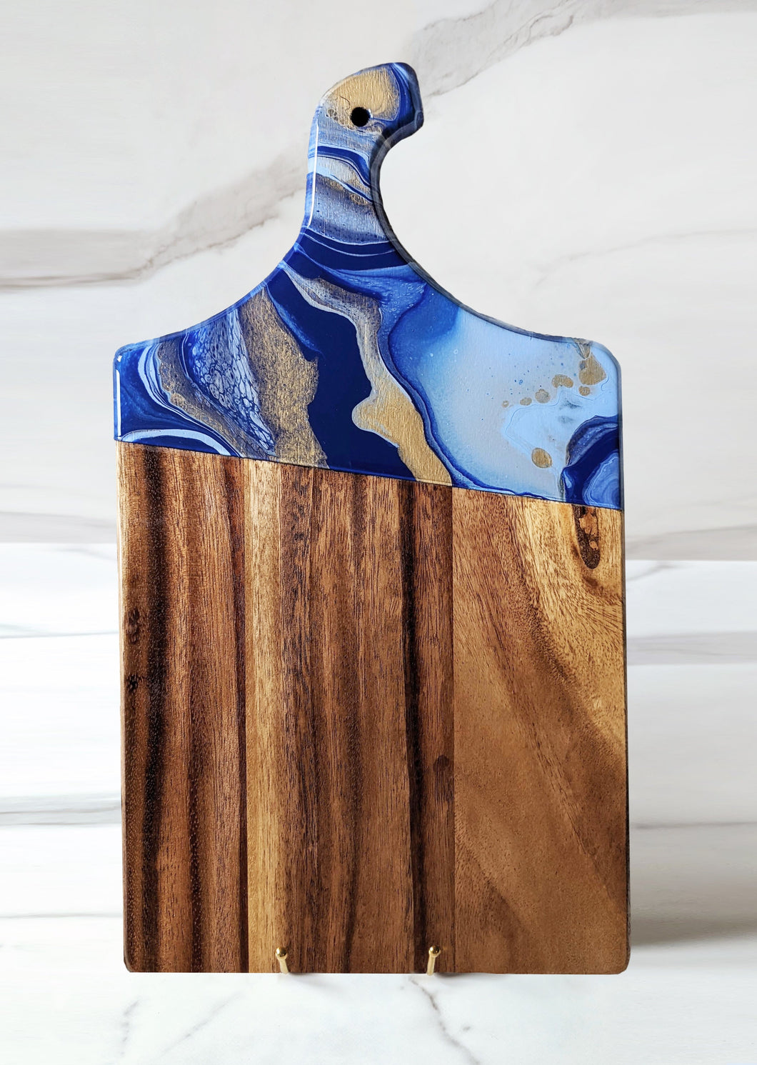 Royal blue, baby blue, and gold marbled charcuterie board