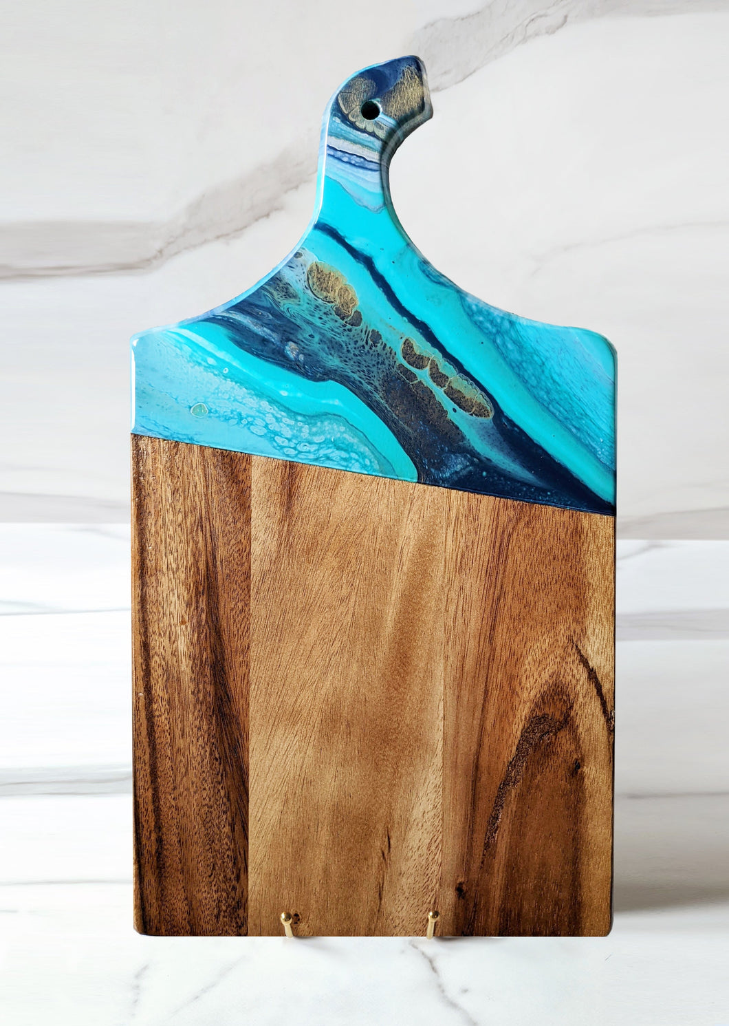 Turquoise, navy, and gold marbled charcuterie board