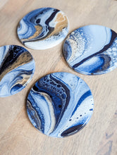 Load image into Gallery viewer, Blue, gold and white marbled coasters
