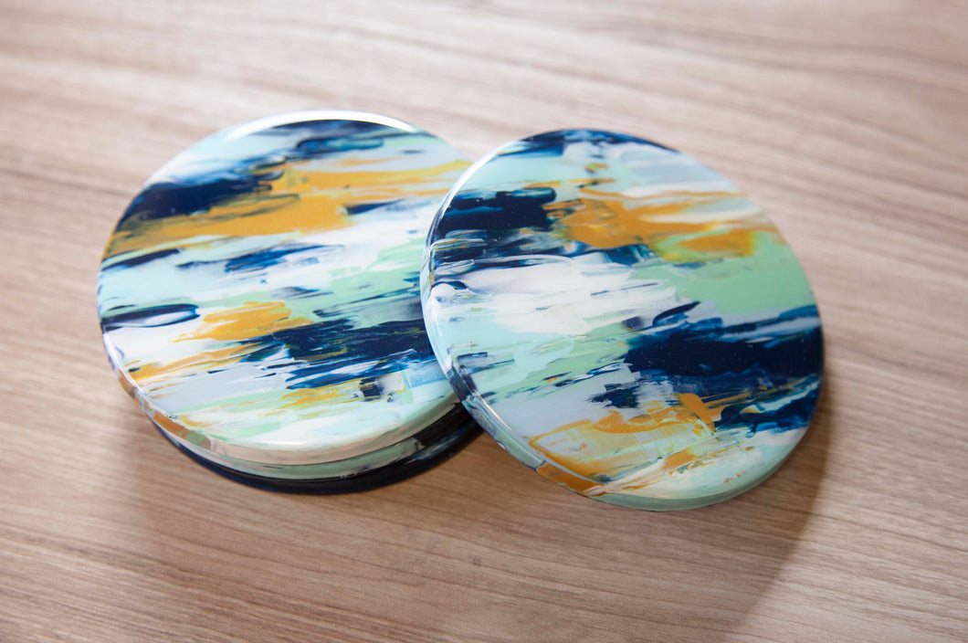 Blue and yellow abstract painted coasters