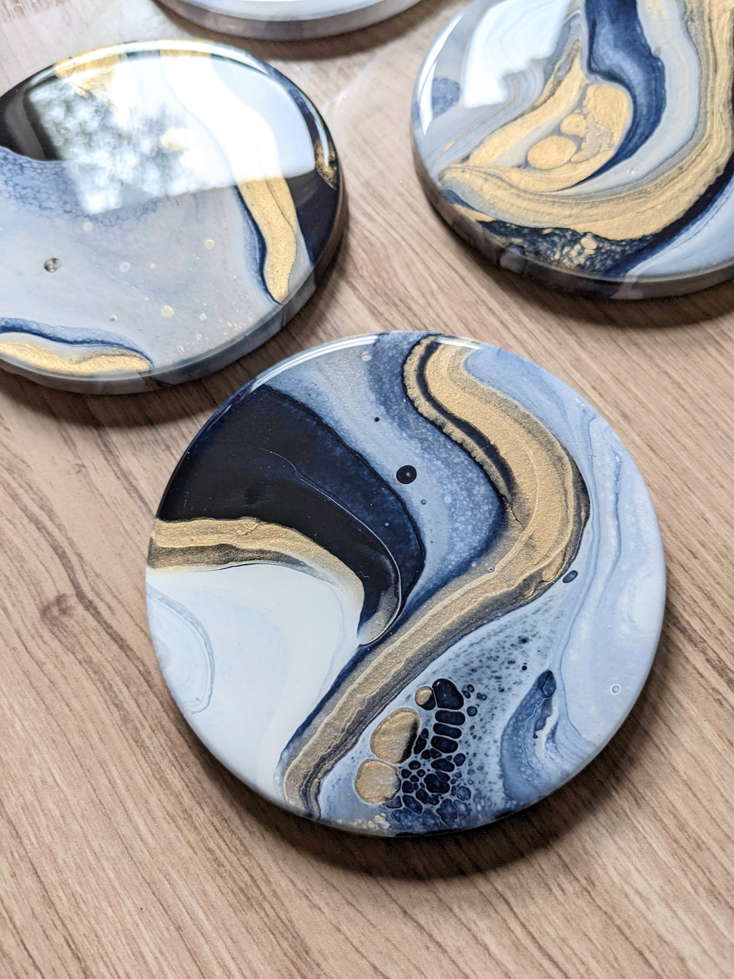 Blue, gold and white marbled coasters
