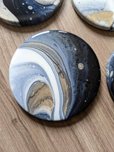 Load image into Gallery viewer, Blue, gold and white marbled coasters
