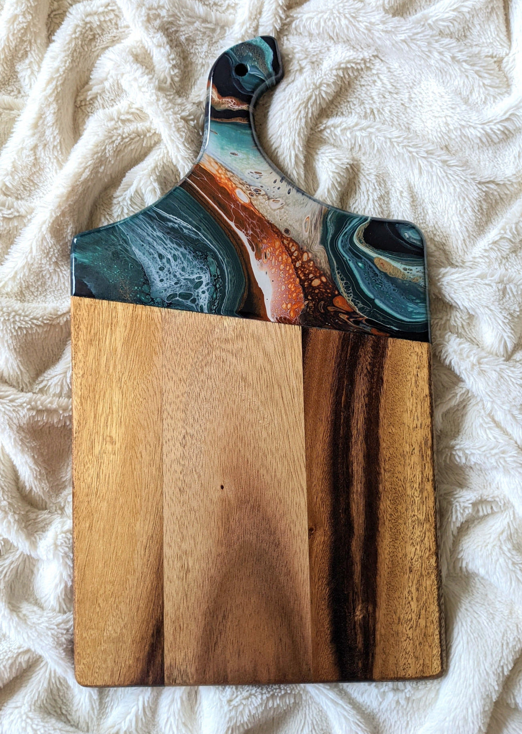Dark teal, white, copper, and gold marbled charcuterie board