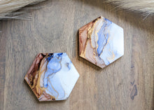 Load image into Gallery viewer, Blue and rust orange alcohol ink coasters
